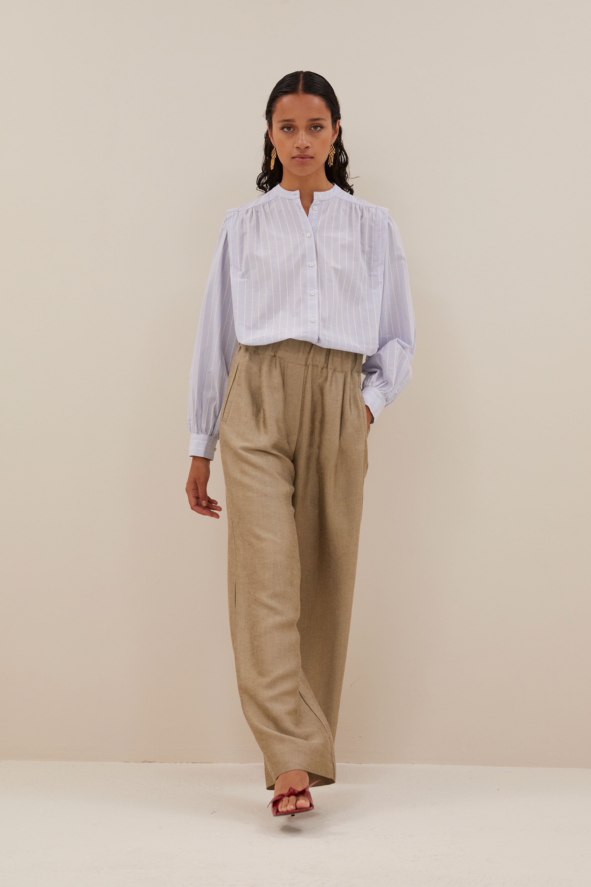 benji gloss pants - gold, elastic band, loose fit, pleated details - by-bar - walking shot