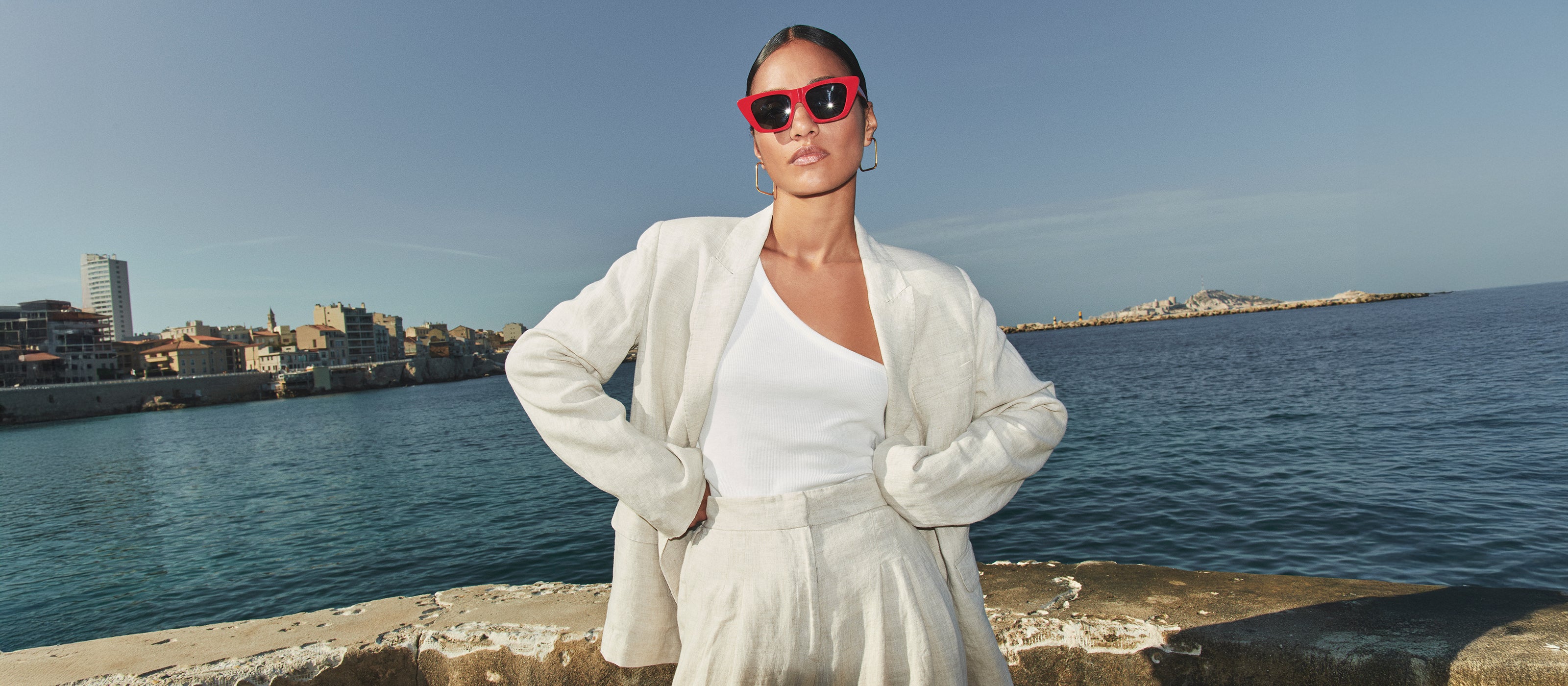 header desktop, aisha with blazer and pants